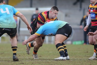 150225 - Newport RFC v Carmarthen Quins - Super Rygbi Cymru (SRC) - Isaac Young of Carmarthen is tackled by Henry Palmer of Newport