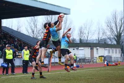 150225 - Newport RFC v Carmarthen Quins - Super Rygbi Cymru (SRC) - Ashton Hewitt of Newport and Gabe McDonald of Carmarthen jump highest as they compete for a high ball