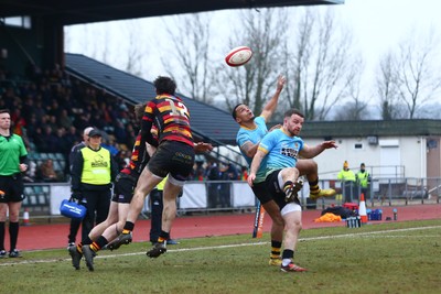 150225 - Newport RFC v Carmarthen Quins - Super Rygbi Cymru (SRC) - Ashton Hewitt of Newport and Gabe McDonald of Carmarthen jump highest as they compete for a high ball