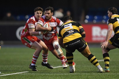 070326 - Newport RFC v Llandovery RFC - SRC Cup Final - Rhodri Jones of Llandovery is challenged by Garin Harris of Newport