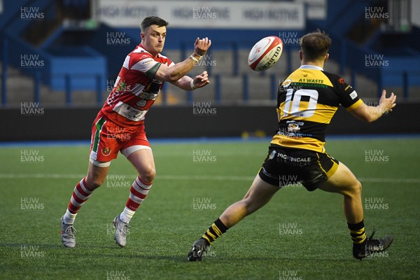 070326 - Newport RFC v Llandovery RFC - SRC Cup Final - Griff Evans of Llandovery is challenged by Jac Lloyd of Newport