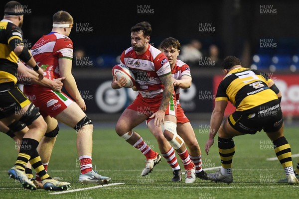 070326 - Newport RFC v Llandovery RFC - SRC Cup Final - Rhodri Jones of Llandovery is challenged by Garin Harris of Newport