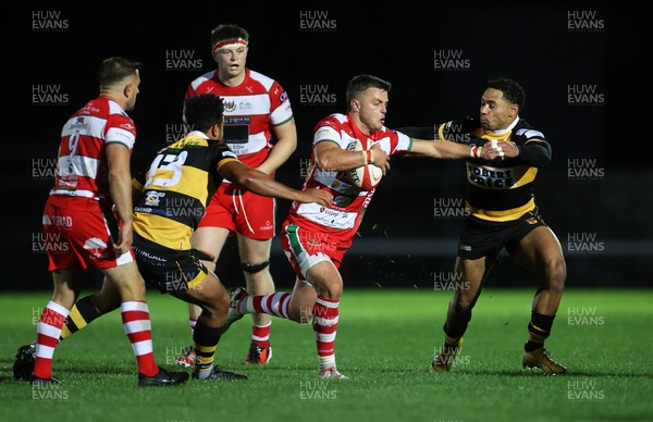 120925 - Newport RFC v Llandovery RFC - Super Rygbi Cymru SRC - Ioan Hughes of Llandovery is tackled by Lloyd Lewis of Newport 
