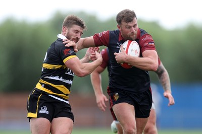 120926 - Newport RFC v Rygbi RGC - Super Rygbi Cymru - SRC - Dion Jones of RGC is tackled by Chay Foster-Smith of Newport 