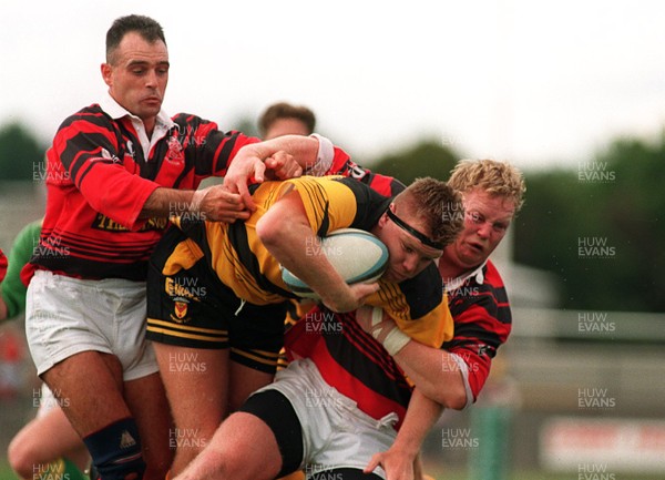 020995 - Newport v Aberavon - Mark Workman of Newport is tackled by Billy Shenton and Mark Watts