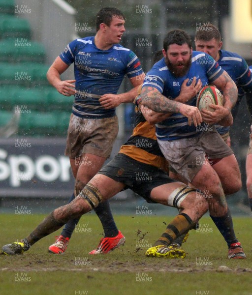 200216 - Newport v Bridgend - Principality Premiership -Bridgend's Dan Matthews crashing through Newport's defence