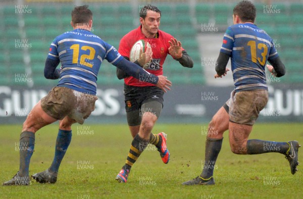 200216 - Newport v Bridgend - Principality Premiership -Newort's Elliot Frewen running at Bridgend's Joe Gatt and Morgan Jones