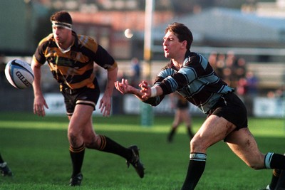 031294 - Newport v Cardiff - Andy Moore releases the ball under pressure from Mike Voyle