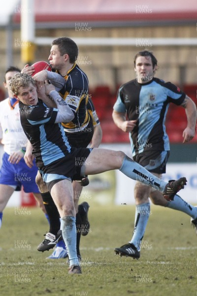 20.02.10 Newport RFC v Cardiff RFC - Swalec Cup - Newport's Gareth Wyatt outjumps Cardiff's Tom Slater. 