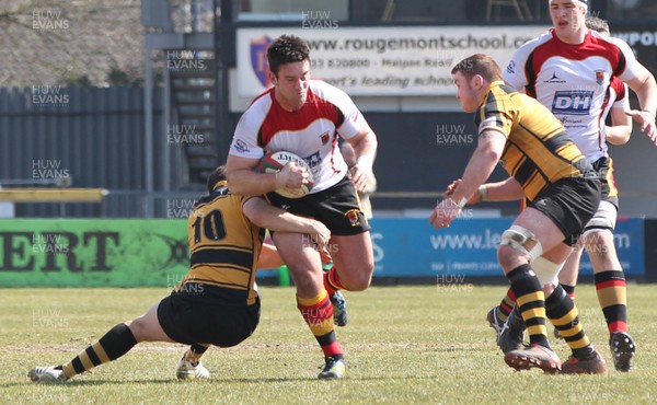 060413 - Newport RFC v Carmarthen Quins, Principality Premiership - Carmarthen Quins' Rheon James is tackled by Newport's Tom Hancock