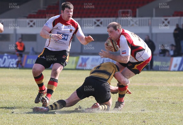 060413 - Newport RFC v Carmarthen Quins, Principality Premiership - Carmarthen Quins' Ian Jones is tackled by Newport's David Pattison