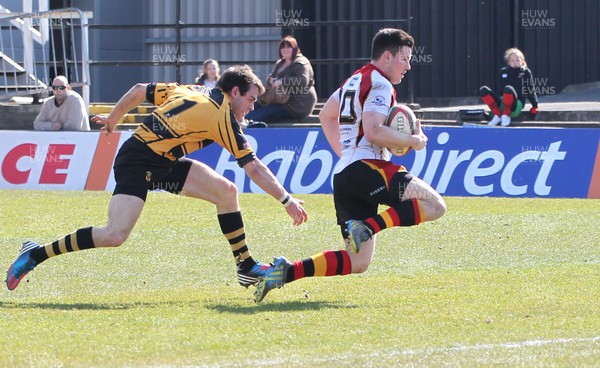 060413 - Newport RFC v Carmarthen Quins, Principality Premiership - Carmarthen Quins' Dan Newton gets away from Newport's Elliot Frewen