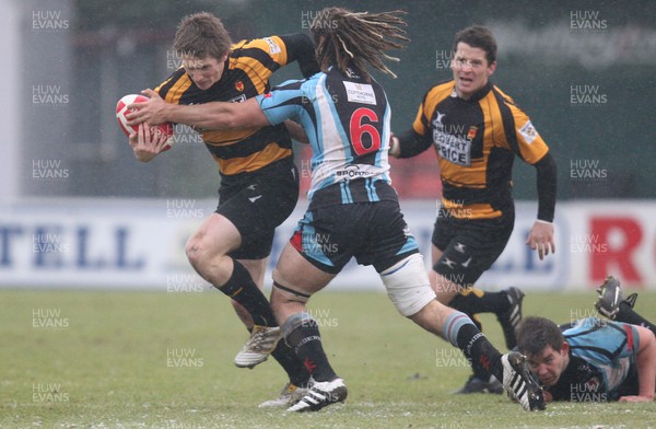 03.01.11.... Newport v Glamorgan Wanderers, Principality Premiership -  Newport's Matthew Pewtner takes on Glamorgan Wanderers' Josh Navidi  