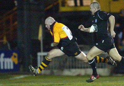 050203 - Newport v Neath - Welsh Premiership - Newport's Paul Young races away from Lee Jarvis to score try