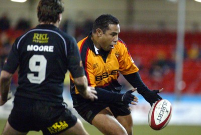 050203 - Newport v Neath - Welsh Premiership - Newport's Ofisa Tonu'u looks to take on Andy Moore