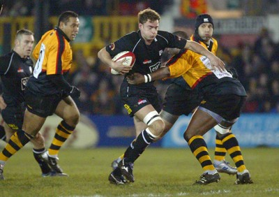 050203 - Newport v Neath - Welsh Premiership - Neath's Adrian Durston is tackled by Steve Ojomoh