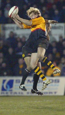 050203 - Newport v Neath - Welsh Premiership - Newport's Percy Montgomery beats Dave Tiueti to high ball