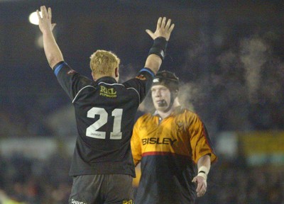 050203 - Newport v Neath - Welsh Premiership - Neath's Jamie Ringer celebrates win as Newport's David Pattison looks on