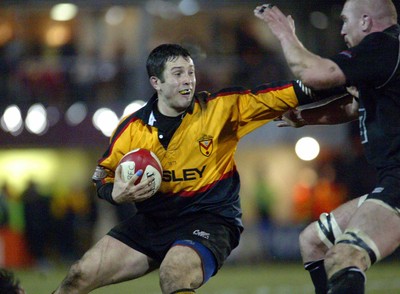 050203 - Newport v Neath - Welsh Premiership - Newport's Jon Pritchard holds off Lyndon Bateman