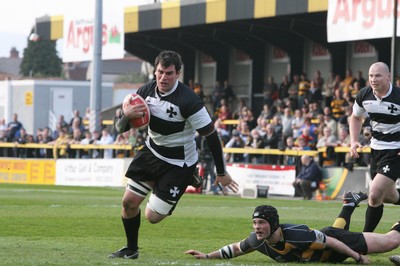 10.04.10 Newport v Neath... Neath's Lee Evans beats tackle by Paul Williams. 