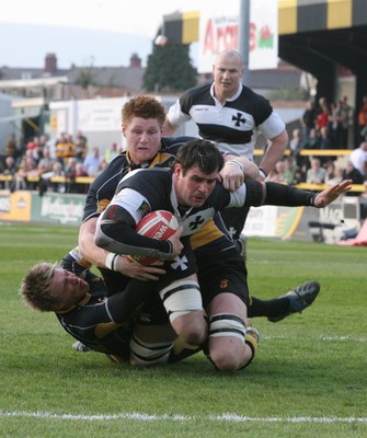 10.04.10 Newport v Neath... Neath's Lee Evans is tackled by Lewis Roblin and Andrew Coombs. 