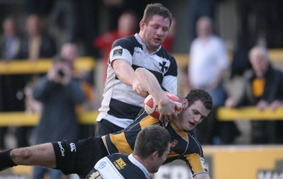 10.04.10 Newport v Neath... Newport's Mike Poole is tackled by Gareth King(15) and Gareth Gravell. 