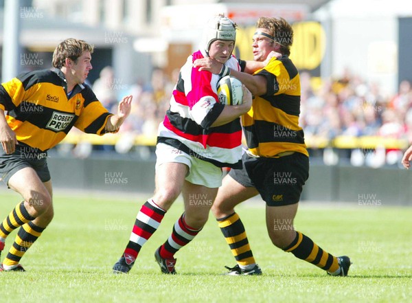 060903 - Newport v Pontypool - Welsh Premiership - Pontypool's Gareth Mason is tackled by Chay Billen