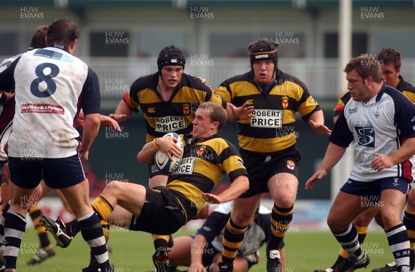 100905 - Newport RFC v Swansea RFC - Gareth Chapman slips up as he tries to get through the Swansea defence