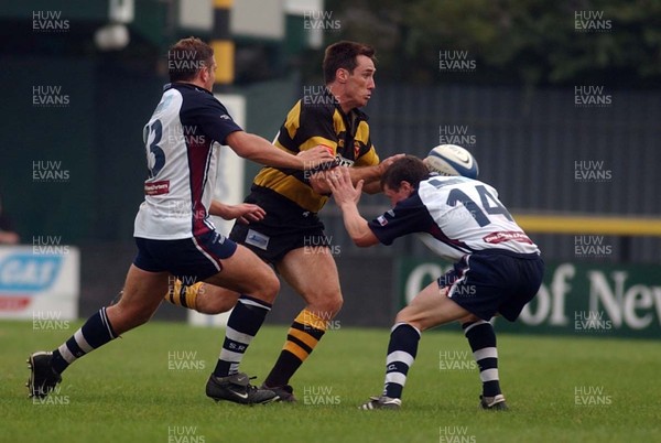 100905 - Newport RFC v Swansea RFC - Newport's Rhys Shorney takes on Matthew Brayley and Leigh Bevan (rt)