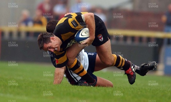 100905 - Newport RFC v Swansea RFC - Newport's Rhys Shorney takes on Matthew Brayley