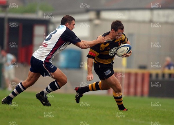 100905 - Newport RFC v Swansea RFC - Newport's Rhys Shorney takes on Matthew Brayley