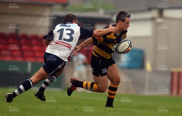 100905 - Newport RFC v Swansea RFC - Newport's Rhys Shorney takes on Matthew Brayley