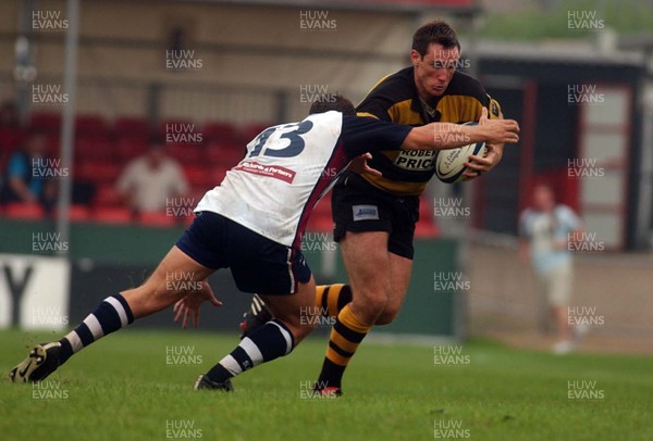 100905 - Newport RFC v Swansea RFC - Newport's Rhys Shorney takes on Matthew Brayley