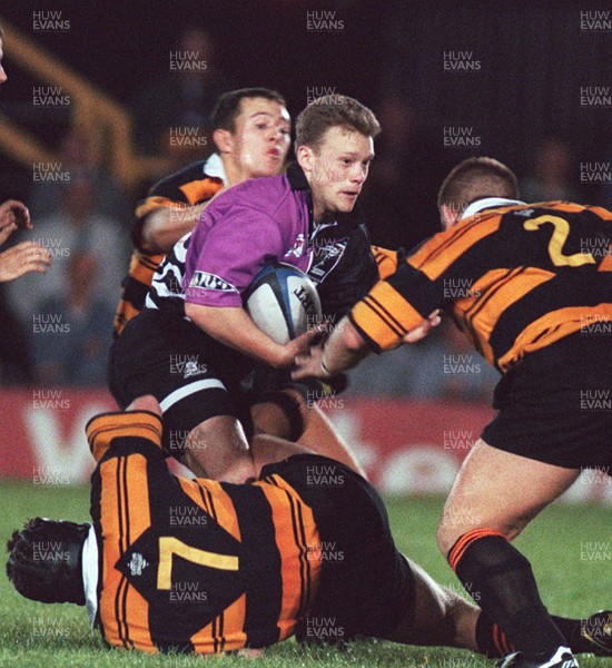 180996 - Newport v Treorchy - Robert Morgan of Treorchy is tackled by David Gray and Ian Jones (right)