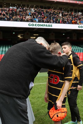 210324 - Newport v Vale of Glamorgan  - Welsh Schools Junior Group U11 DC Thomas Plate Final - Roy Bergiers consoles  the losing Newport players as he presents their medals 