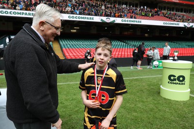 210324 - Newport v Vale of Glamorgan  - Welsh Schools Junior Group U11 DC Thomas Plate Final - Roy Bergiers consoles  the losing Newport players as he presents their medals 