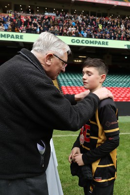 210324 - Newport v Vale of Glamorgan  - Welsh Schools Junior Group U11 DC Thomas Plate Final - Roy Bergiers consoles  the losing Newport players as he presents their medals 
