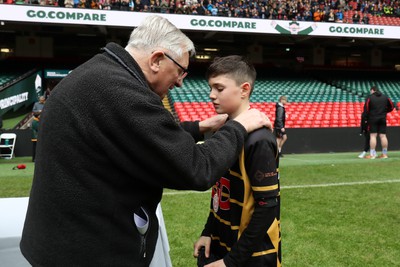 210324 - Newport v Vale of Glamorgan  - Welsh Schools Junior Group U11 DC Thomas Plate Final - Roy Bergiers consoles  the losing Newport players as he presents their medals 
