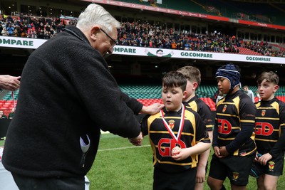 210324 - Newport v Vale of Glamorgan  - Welsh Schools Junior Group U11 DC Thomas Plate Final - Roy Bergiers consoles  the losing Newport players as he presents their medals 