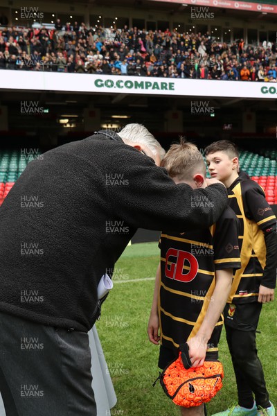 210324 - Newport v Vale of Glamorgan  - Welsh Schools Junior Group U11 DC Thomas Plate Final - Roy Bergiers consoles  the losing Newport players as he presents their medals 