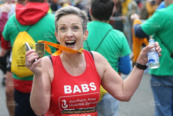 290418 - ABP Newport Wales Marathon - Runners show their emotions at completing the ABP Newport Wales Marathon