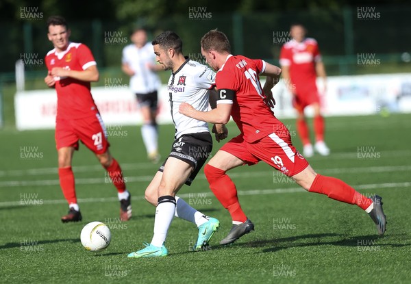 130721 - Newtown v Dundalk, UEFA Europa Conference League first qualifying round, second leg - Michael Duffy of Dundalk gets away from Craig Williams of Newtown