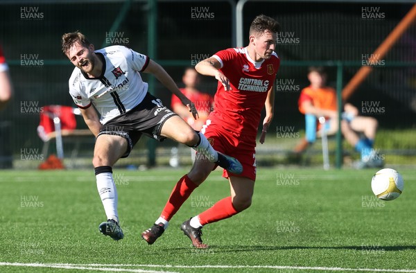 130721 - Newtown v Dundalk, UEFA Europa Conference League first qualifying round, second leg - Will Patching of Dundalk and Alexander Fletcher of Newtown compete for the ball