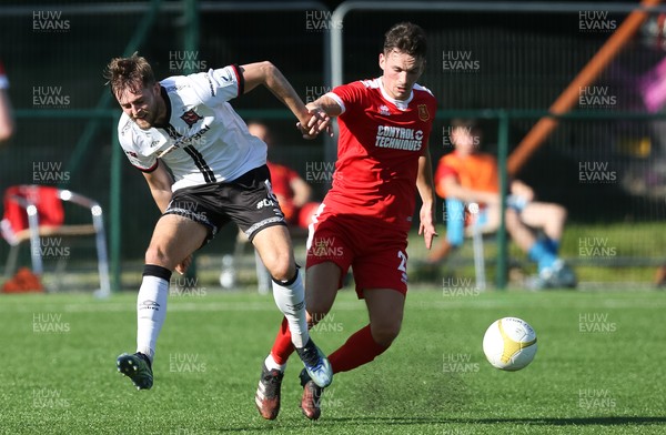 130721 - Newtown v Dundalk, UEFA Europa Conference League first qualifying round, second leg - Will Patching of Dundalk and Alexander Fletcher of Newtown compete for the ball