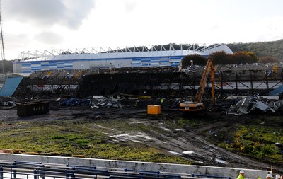 22.10.09 -  Demolition of Grandstand at Ninian Park , former ground of Cardiff City FC. The new City Stadium towers above the demolished grandstand at Ninian Park. 