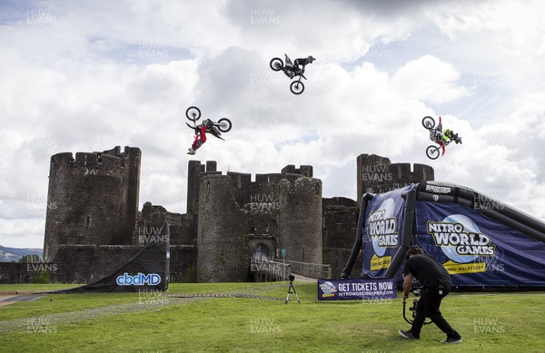 100919 - Nitro World Games - **Composite** Picture shows riders Jackson Strong, Josh Sheehan and Luc Ackerman setting a new world record for three riders doing double backflips at once in front of Caerphilly Castle, South Wales