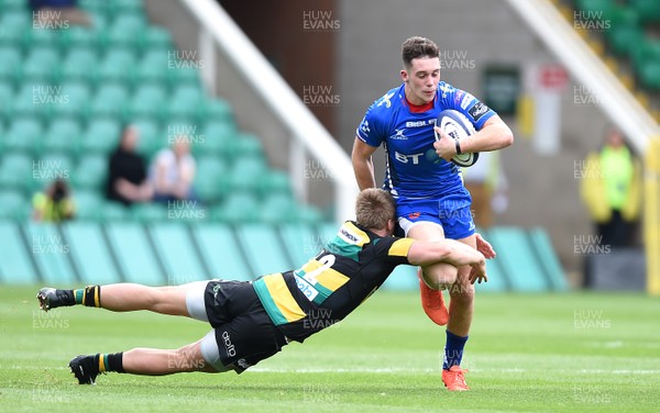 120817 - Northampton Saints v Dragons Rugby - Preseason Friendly - Joe Goodchild of Dragons gets away from Rory Hutchinson of Northampton