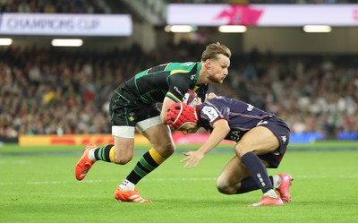 240525 - Northampton Saints v Union Bordeaux-Begles, EPCR Champions Cup Final - Rory Hutchinson of Northampton Saints is tackled by Louis Bielle-Biarrey of Union Bordeaux-Begles