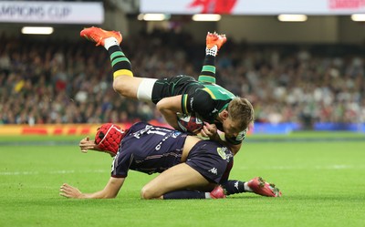 240525 - Northampton Saints v Union Bordeaux-Begles, EPCR Champions Cup Final - Rory Hutchinson of Northampton Saints is tackled by Louis Bielle-Biarrey of Union Bordeaux-Begles