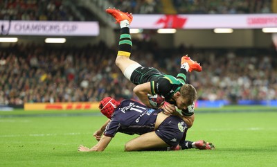 240525 - Northampton Saints v Union Bordeaux-Begles, EPCR Champions Cup Final - Rory Hutchinson of Northampton Saints is tackled by Louis Bielle-Biarrey of Union Bordeaux-Begles